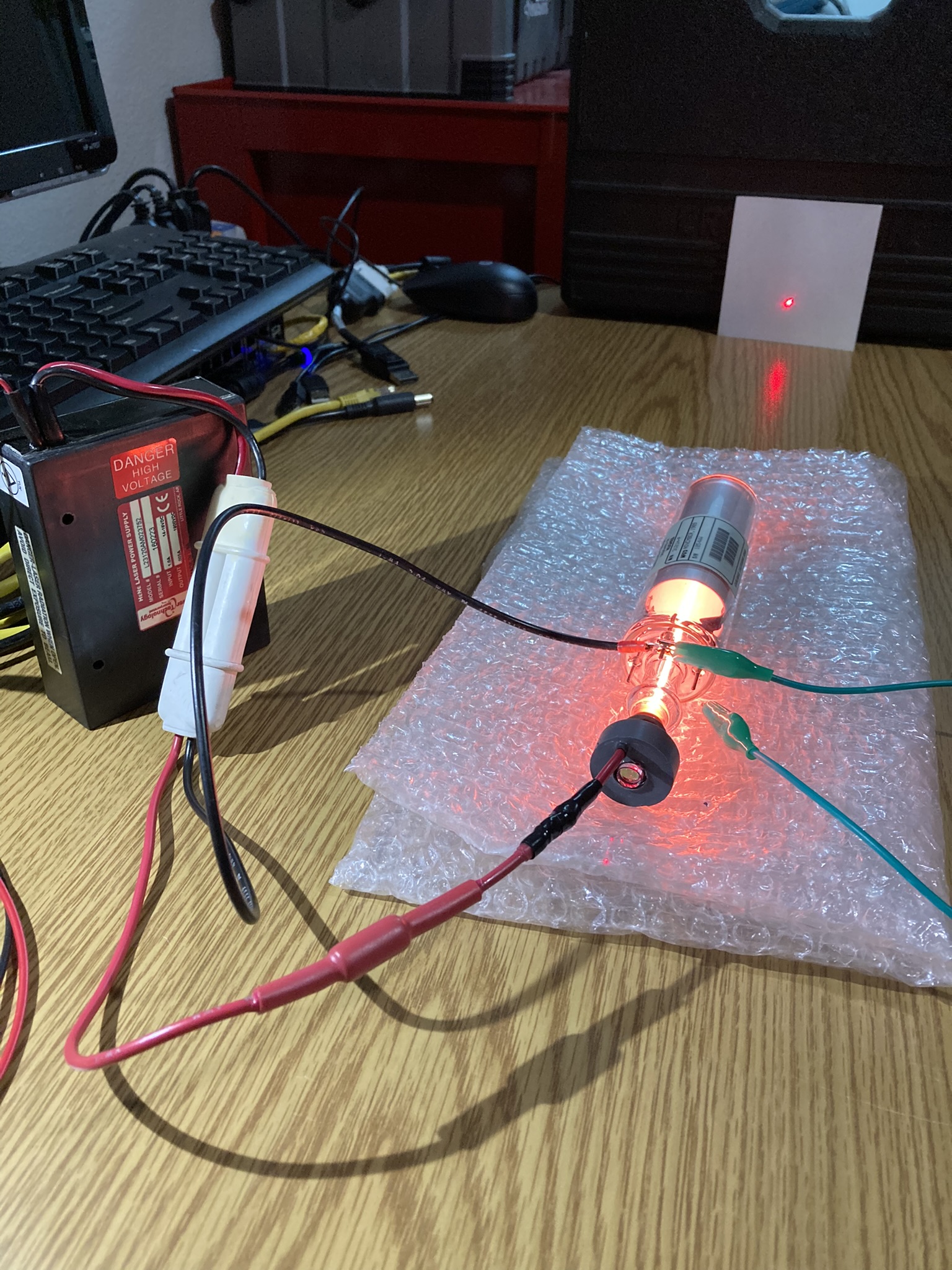 tube on and lasing a red beam