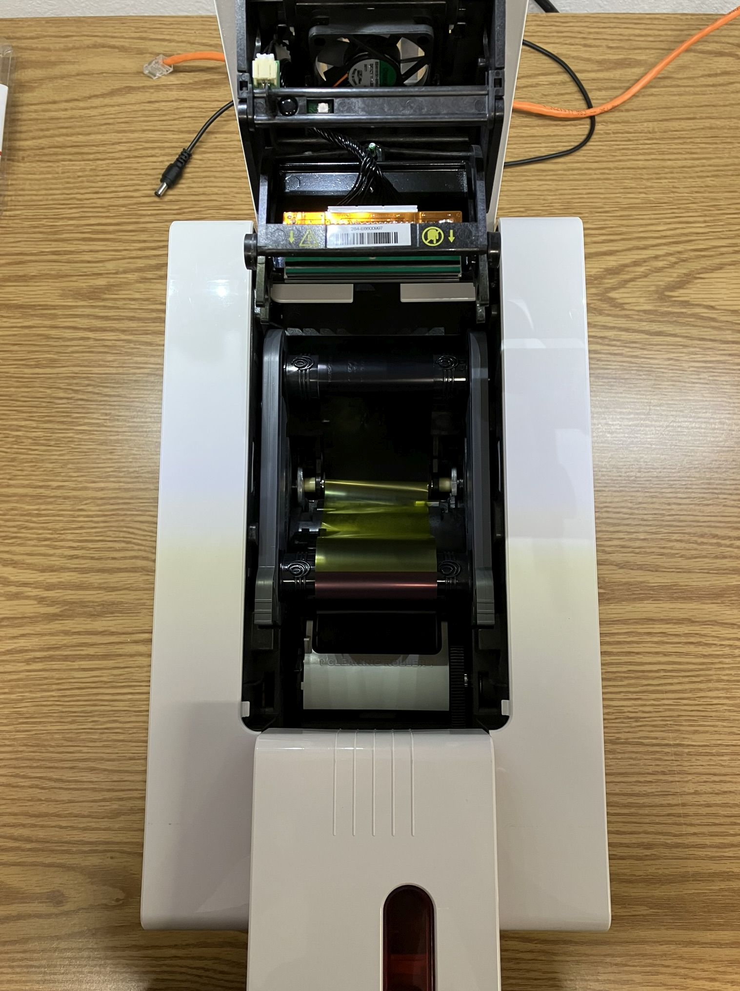 Primacy ribbon compartment with thermal print-head and ribbon visible